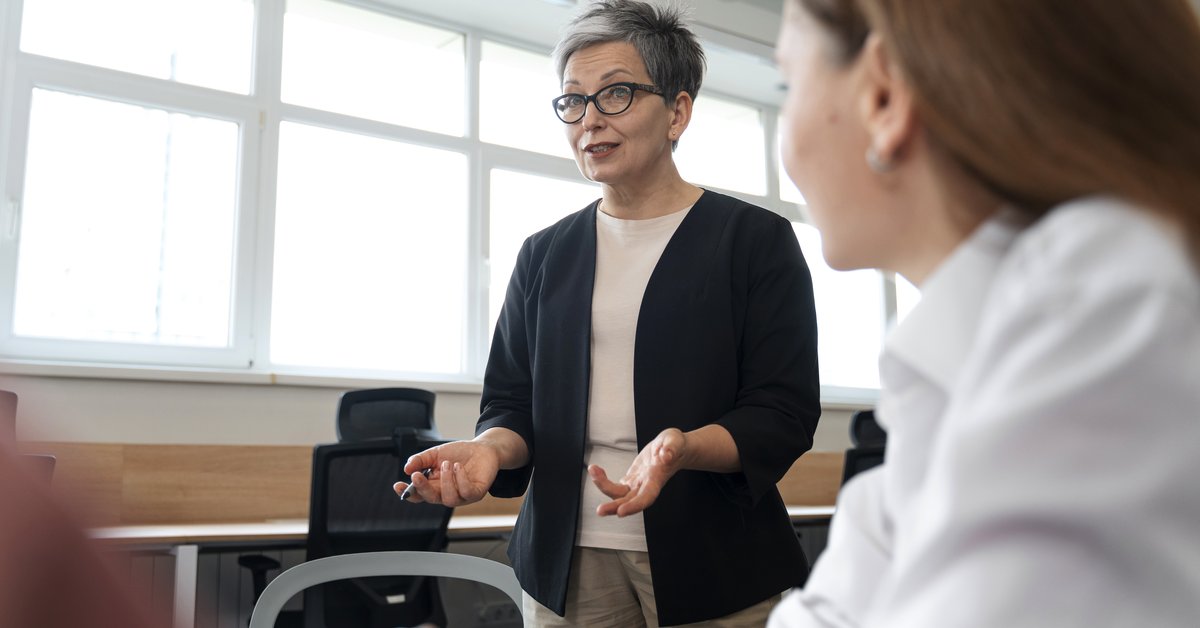 Multi-generational mentoring session between young and senior professionals